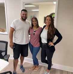 Jenn Mitchell with clients at a Tampa closing